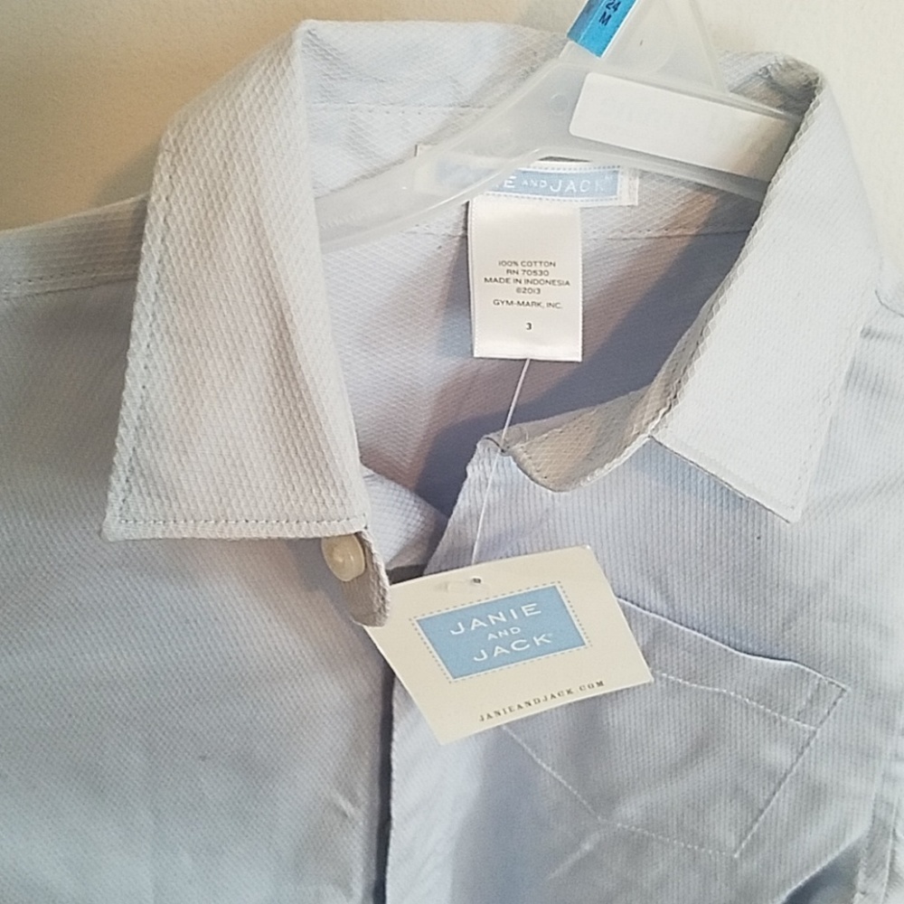 Brand new. Blue button down, perfect for holidays!